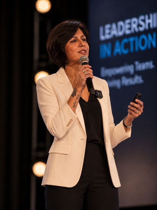 Urmila Menon speaking on stage